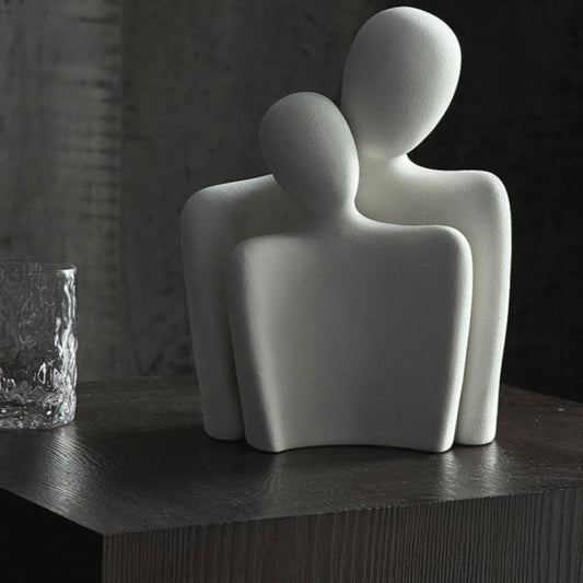 Moderne abstrakt skulptur, der symboliserer forbindelse og ømhed dekoration