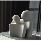 Moderne abstrakt skulptur, der symboliserer forbindelse og ømhed dekoration