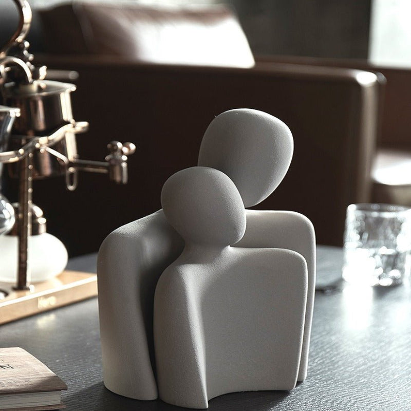 Moderne abstrakt skulptur, der symboliserer forbindelse og ømhed dekoration