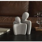 Moderne abstrakt skulptur, der symboliserer forbindelse og ømhed dekoration