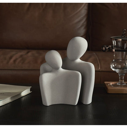 Moderne abstrakt skulptur, der symboliserer forbindelse og ømhed dekoration