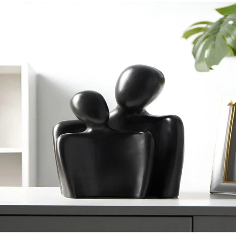 Moderne abstrakt skulptur, der symboliserer forbindelse og ømhed dekoration